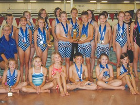 LOGAN CLOW/DAILY HERALD-TRIBUNE 
Swimmers with the Grande Prairie Aquarians summer club pose their medals from a swim meet in Peace River on Aug. 10-11. Twenty-four swimmers qualified for the Alberta Summer Swimming Association’s Provincial Championship this weekend (Aug. 16-18) in Edmonton.