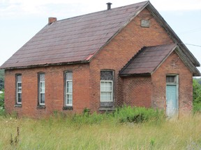 The Nature Conservancy of Canada is preparing to tear down 20 buildings on properties it owns in South and North Walsingham. Among them, from left, are an old school house on South Walsingham Road 2, a derelict house on North Walsingham Concession Road 8 and an old pack barn on the South Walsingham West Quarter Line Road. (MONTE SONNENBERG Simcoe Reformer)