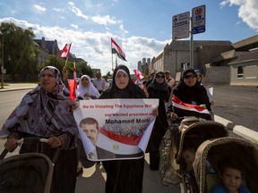 Egyptians living in Kingston marched from Queen's University to City Hall on Thursday, claiming Mohamed Morsi to be the country's rightful president. 
Sam Koebrich for The Whig-Standard