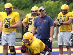 Queen's Golden Gaels head football coach Pat Sheahan shouts instructions during a drill for the offensive line during the first day of the team’s training camp at Queen's University’s West Campus on Thursday. (Ian MacAlpine/The Whig-Standard)