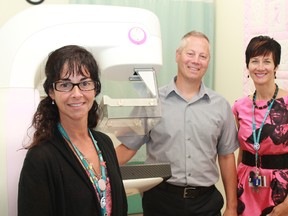 The new Timmins and District Hospital Breast Wellness Centre is currently undergoing a dramatic facelift to ensure that patient care is a priority. The proceeds from the annual John P. Larch Charity Golf Classic being held Friday, Aug. 23 and Saturday, Aug. 24 will help to fund this transition. Tina Bilodeau, Guy Guidon and Janna Cook pose next to a mammographer, just one of the state of the art equipment that makes the TDH facility the pre-eminent breast wellness centre in the Northeast.