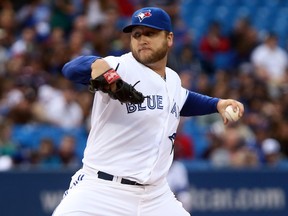 Mark Buehrle of the Toronto Blue Jays throws a pitch against the Boston Red Sox during MLB action in Toronto on August 15, 2013. (Dave Abel/QMI Agency)