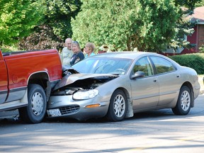 No injuries were reported in a rear-end collision on Victoria Street Friday morning near the intersection of Oakwood Avenue. Driver of the Concorde, which was badly damaged, was Marie Lazaruk of Waterford, who is standing to the left of the OPP cruiser.   (MONTE SONNENBERG Simcoe Reformer)