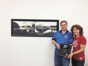 Clarence Samuelson, John Maland band director and member of the committee that planned last month’s International Musicfest, received a plaque of appreciation from mayor Anita Fisher on Thursday, Aug. 8.
Samuelson and the school bands are now planning trips to Belize in 2014 and Brazil in 2015.