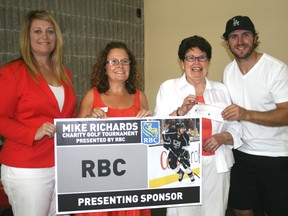 Lead organizer of the Mike Richards 2013 Charity Golf Tournament, Kathleen Novak, far left, and Los Angeles Kings centre, Mike Richards, far right present a cheque for $17,864.14 to Kenora and Lake of the Woods Community Foundation directors, Kelly Williams, second from left, and Meg Cameron, second from right. The fourth annual tournament was a success raising a grand total of $35,728.27, the other half will be donated to the Canadian Cancer Society.
GRACE PROTOPAPAS/KENORA DAILY MINER AND NEWS