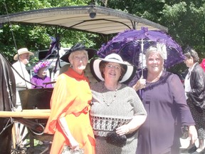 Queens of Red Hat chapters from Bruce and Grey County gathered at The Doctor’s House B&B in Tara Wednesday for a practice run of their upcoming Gone with the Wind Gala which is set to be held in September. They were also at the B&B to be taped by a new series- Cottage Cheese, which is set to launch on the Cottage Life TV network this fall. Pictured from left to right: Alein Atkinson, Sheila Ewing and Leone Taylor of the Wiarton Forget-Me-Nots posing before a horse-drawn ride through town, courtesy of Windsong Horse and Carriage.