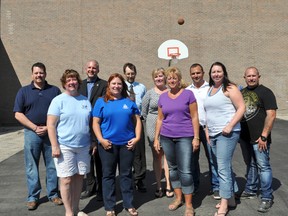 Pictured are Portage Community Revitalization Corp.'s Lori Judson, front left, Portage Rotary Club's Jean-Marc Nadeau and Guy Moffat, back left, parent council members Karly Friesen, Wayne Harris, Connie Bromley, Aggie Foster and Stephanie Brown; Meseyton Construction's Paul Meseyton and E.F. Moon Construction's Jack Meseyton. The construction companies donated their labour and equipment, while Rotary donated $2,500-plus and PCRC donated $3,000 to cover the cost of the asphalt. (CLARISE KLASSEN/PORTAGE DAILY GRAPHIC/QMI AGENCY)