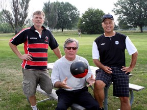 Looking to possibly make rugby and soccer pitches at Belle Park Fairways, from left, Matt Dowling of the Kingston Panthers Rugby Club and from the Eastern Ontario Soccer Association,  Jim Cannovan and Mark Ethier gather by the putting green on Tuesday morning of the city owned and run golf course.
Ian MacAlpine The Whig-Standard
