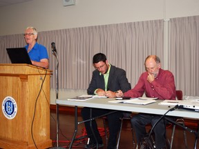 Central Elgin Coun. Sally Martyn, left, speaks during a public meeting about creating a heritage conservation district in Port Stanley on Thursday, Aug. 15, 2013 at the Port Stanley Arena. Taking notes are consultants Nick Bogaert and David Cuming, who helped create a set of draft guidelines for the district. Ben Forrest/QMI Agency/Times-Journal