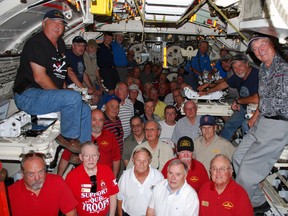 About 50 former submariners crowd into a torpedo room at HMCS Ojibwa in Port Burwell on Saturday, Aug. 17, 2013. The group was in town for the annual general meeting of the Submariners' Association of Canada. Ben Forrest/QMI Agency/Times-Journal