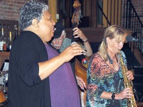 Vocalist Jackie Richardson warms up Saturday afternoon at the Church Restaurant with fellow musicians Dave Young on bass and Jane Bunnett on sax. (DONAL O'CONNOR The Beacon Herald)