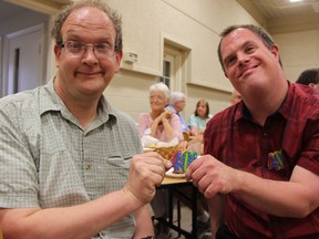 Roommates Greg Plug, left, and Scott Wilding celebrated both their birthdays at Redeemer Christian Reformed Church in Sarnia, Ont. Saturday, Aug. 17, 2013. The Sarnia men, who both have developmental disabilities, have lived together for 18 years thanks to the support of community agencies. BARBARA SIMPSON / THE OBSERVER / QMI AGENCY