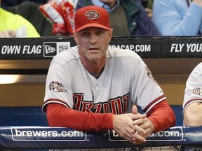 Arizona Diamondbacks manager Kirk Gibson watches from the dugout during a 2011 game. (REUTERS/Jeff Haynes)
