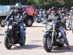 Jody Mitic, left, and Trevor Bouden get ready to head out and lead the pack during Saturday's fourth annual motorcycle ride for the Never Quit Foundation. Mitic is one of the founders of Never Quit, a non-profit organization dedicated to raising money and awareness for adaptive living and giving back to wounded soldiers, police officers, firefighters and paramedics injured in the line of duty. For more community photos, please visit our website photo gallery at www.thedailyobserver.ca.