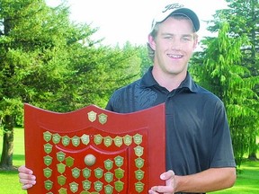 Ben Hopkinson holds the Stratford city golf championship shield Sunday after winning the 2013 title with a round of 72 at the Stratford County Club. Hopkinson shot 69 at the Municipal golf course in Saturday's opening round. (STEVE RICE, The Beacon Herald)