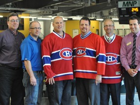 Portage Rotary Club members Jim Brands, Chris Tompkins, Dean Cairns, Jean-Marc Nadeau, Preston Meier and Tyler Dunn after the announcement that a Montreal Canadiens alumni team would be coming to Portage Oct. 25. (Kevin Hirschfield/The Graphic)