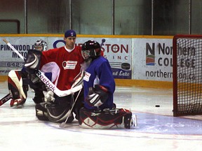 Bryden Daoust gives some tips to Rayden Thomas during Saturday's goalie school at the complex.