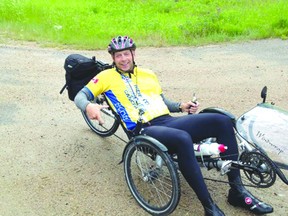 Darrell Macdonald rests during the journey, which involved more than 200 kilometres of biking. Photo/SUBMITTED