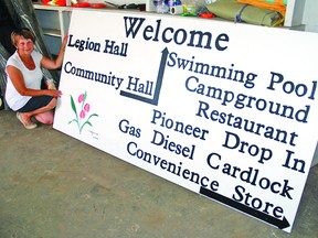 Champion Communities in Bloom took on a wayfinding project to direct visitors to local venues like the pool, campground, legion and community hall. Here, CiB chair Marilyn Wolfe showed the Advocate one of the signs that will be ready for installation once approval has been received to dig out the postholes. This sign will be put up at the village’s east entrance on Highway 529, which sees lots of traffic heading to Little Bow Provincial Park. Simon Ducatel Vulcan Advocate