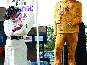 Mayor Linda Osinchuk, in period dress, looks on following the unveiling of the newest addition to Heritage Mile, the Sam Steele sculpture Thursday, Aug. 15. Leah Germain/Sherwood Park News/QMI Agency