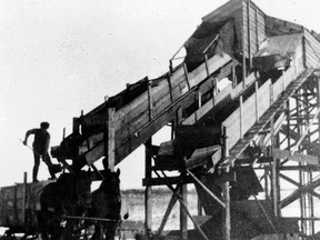 A horse-drawn wagon is loaded at a coal shaft in Clover Bar in 1909.  Photo Courtesy Strathcona County Museum and Archives