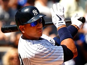 New York Yankees' Alex Rodriguez watches an RBI single against the Detroit Tigers August 11, 2013. (REUTERS/Adam Hunger)