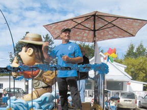 Coun. Robert Kohn who represents Darwell on the county council waves from the county float.