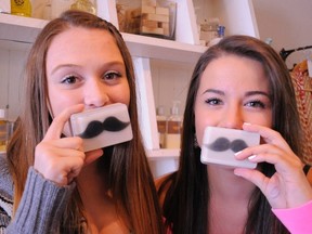 Claire Ventoso (left) and Sarah McGee, both 15 and from Port Dover, hold soap made by Cottage North for the upcoming Gentlemen of the Road concert weekend (Aug. 23 & 24) in Simcoe. (DANIEL R. PEARCE Simcoe Reformer)