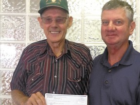 MLA George VanderBurg, right, presents a cheque for $25,876 to John Heaven, Mayerthorpe & District Agricultural Society president, from the 2013 Agricultural Societies Grant Program through Alberta Agriculture and Rural Development for the society.
 
Submitted photos