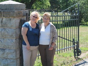 Karen Revelle, left, and her cousin Beth Revell Hunter Medlen, a resident of Amherstview and former Lake Ontario Park employee, stand at the entrance to the park during Revelle's visit to Kingston this July. Beth, the daughter of Ernie Revell, lived at the park with her family behind the canteen when she was growing up.
Submitted photo