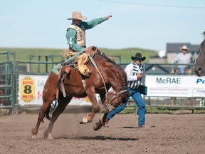 Dustin Flundra at the Pincher Creek pro rodeo in 2013.Flundra has finally won the Saddle bronc contest at the 2014 Calgary Stampede. Chanelle Seguin photo/QMI Agency