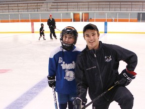 Garrett Meurs of Ripley recently ran a hockey school Kincardine from Aug. 12 to 16 where he taught kids the skills of hockey. Meurs who recently signed an entry level contract with the Colorado Avalanche in March is ready to move forward with his career after playing four successful years with the OHL Plymouth Whalers. Meurs (right) with one of his hockey school kids, seven-year-old Chris Martins who came all the way from Plymouth, Michigan for the week long hockey school.