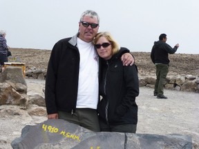 Kenton Klassen and Maureen Matchett shiver at 4910 m above sea level, over looking the Cordillera of Volcanoes in Peru.