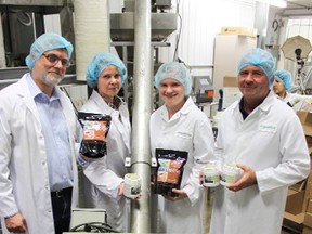 From left, Dr. Craig Hudson, his wife Susan, Dianne Donaldson and her father Dale hold the ZenBev sleep aid product of Biosential Inc. as one of the first batches of the product is processed at Seaforth’s Everspring Farms.