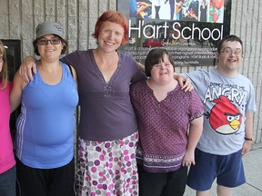 H'art School teacher Toni Thornton, centre, joins with some of the students who took part in a summertime planting project. From left they are Quinn Robertson, Francine Young, Laura Quesnelle and Paul Sheridan.
Michael Lea The Whig-Standard