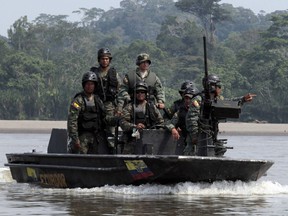 Ecuadorean troops patrol Napo River, the main entrance to Yasuni National Park, in Coca September 10, 2010. (REUTERS/Guillermo Granja)