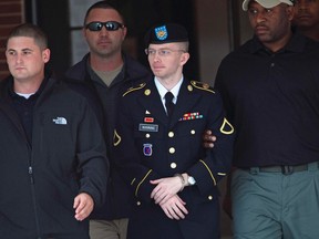 U.S. soldier Bradley Manning is escorted out of a courthouse during his court martial at Fort Meade in Maryland, August, 20, 2013. (REUTERS/Jose Luis Magana)