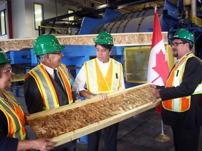 From left, Marianne Berube, Executive Director Woodworks (Canadian Wood Council); Tillsonburg Mayor John Lessif, Dr. Eric Hoskins, Provincial Minister of Economic Development, Trade and Employment; and Bruno Lebel, President International Beams Inc., share a laugh following Thursday’s official announcement of a $2.4 million loan to International Beams Inc. The Southwest Ontario Development Fund (SWODF) support is anticipated to help create 29 additional jobs, bringing total employment at the 10 Rouse Street mill to 55. Jeff Tribe/Tillsonburg News