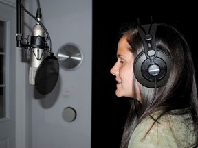 AMBER VAN WORT For The Intelligencer
Trained singer Brittany Brant helps out the Joyful Noise choir by recording scratch tracks. These recordings are used as vocal guide tracks to help the choir learn songs when they start practicing this September.