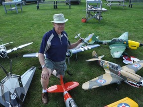 JASON MILLER The Intelligencer
Quinte Aeromodellers Club member Gil Atwood, kneels amongst  several model radio control aircrafts which will be on display at the clubs 540 Victoria Road, Prince Edward County location on Aug. 31, from 9 a.m.-2 p.m.