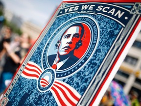 A placard at a German protest against the U.S. National Security Agency mocks the “Yes We Can” chant that accompanied U.S. President Barack Obama's rise to power in more optimistic times.