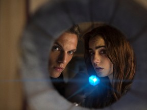 Jace (Jamie Campbell Bower) and Clary (Lilly Collins) are shadowhunters, who search and destroy demons in The Mortal Instruments: City of Bones.