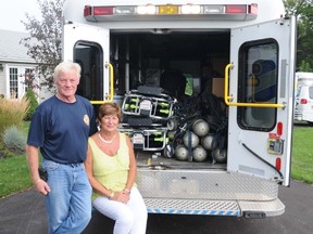 Carl and Christina Eggiman sit on the rear bumper of an ambulance they recently had donated to them by Hastings-Quinte EMS. The ambulance, as well as thousands of dollars of medical and firefighter supplies, is being transported to Punta Cana to assist emergency services there.