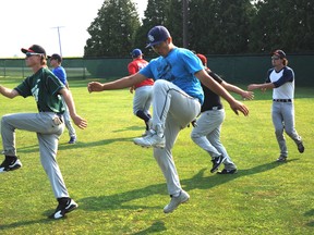 Sarnia Braves U18 players stretch at Blackwell Park prior to practice on Wednesday. The Braves head to Toronto for the provincial championships starting Friday, Aug. 23. (SHAUN BISSON, The Observer)