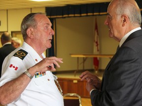 Korean War veteran Bob Maginn, 80, of St. Thomas, chats with Veterans Affairs Minister Julian Fantino at Sarnia's Royal Canadian Legion branch Thursday. Fantino and Sarnia-Lambton Pat Davidson presented certificates of recognition to all area Korean War veterans at a special luncheon. BARBARA SIMPSON / THE OBSERVER / QMI AGENCY