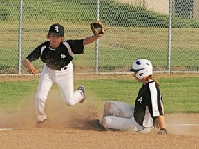 The Grove peewee White Sox will be looking for defensive plays like this one at third base against the Alberta bantam girls’ all-star team to help carry them to a possible Western Canadian Triple A championship this weekend. - Gord Montgomery, Reporter/Examiner