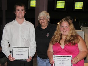Ben Walker and Chantal Legere accept $500 scholarships from the Lambton County Ten Pin Association. The awards were presented by Association Manager Shirley Matthews. (SHAUN BISSON, The Observer)