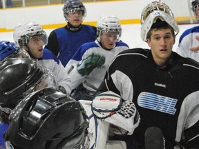 KEITH DEMPSEY For The Sudbury Star
Goaltender Andrew Lefebvre, surrounded by other players at training camp, listens to directions given by the Nickel Barons coaching staff.