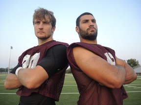 Ottawa Gee-Gees defensive back Dustin Wilson (left) and defensive lineman Ettore Lattanzio. (Tim Baines, Ottawa Sun)