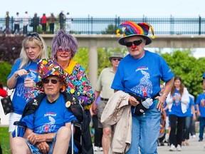 Walter Berg, Janice Berg and Lyn Beckett of the team 'Clowning Around with the Movers and Shakers' take part in the Parkinson SuperWalk in St. Catherine's, Ont. in 2012.